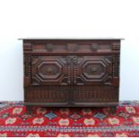 Composite 18th century oak chest, the moulded rectangular top over panelled frieze drawers, deep