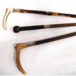 Three vintage silver-collared riding crops, two horn-handled, the other leather-bound.  (3)