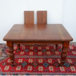 Late Victorian mahogany extending dining table, the moulded rectangular top raised on baluster
