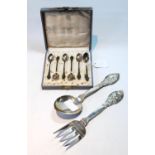 Pair of Norwegian silver salad servers with embossed animals, by Andersen, and a set of six black-