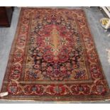 Rug with floral medallion over blue ground, all over floral decoration, spandrels, and triple