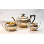 Silver three-piece tea set of part-fluted oval shape, Sheffield 1906, 32oz.