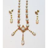 Victorian gold necklace with graduated opal and ruby clusters, with similar drops, and a pair of