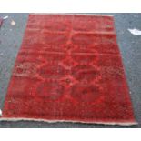 Afghan rug with two rows of five guls over red ground, and multiple border, 170cm x 129cm.