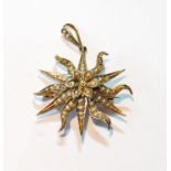 Starburst brooch/pendant with wavy rays set with pearls, '9ct', three pearls missing, 5.7g.