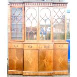 Sheraton Revival mahogany breakfront bookcase with projected cornice over carved frieze, astragal