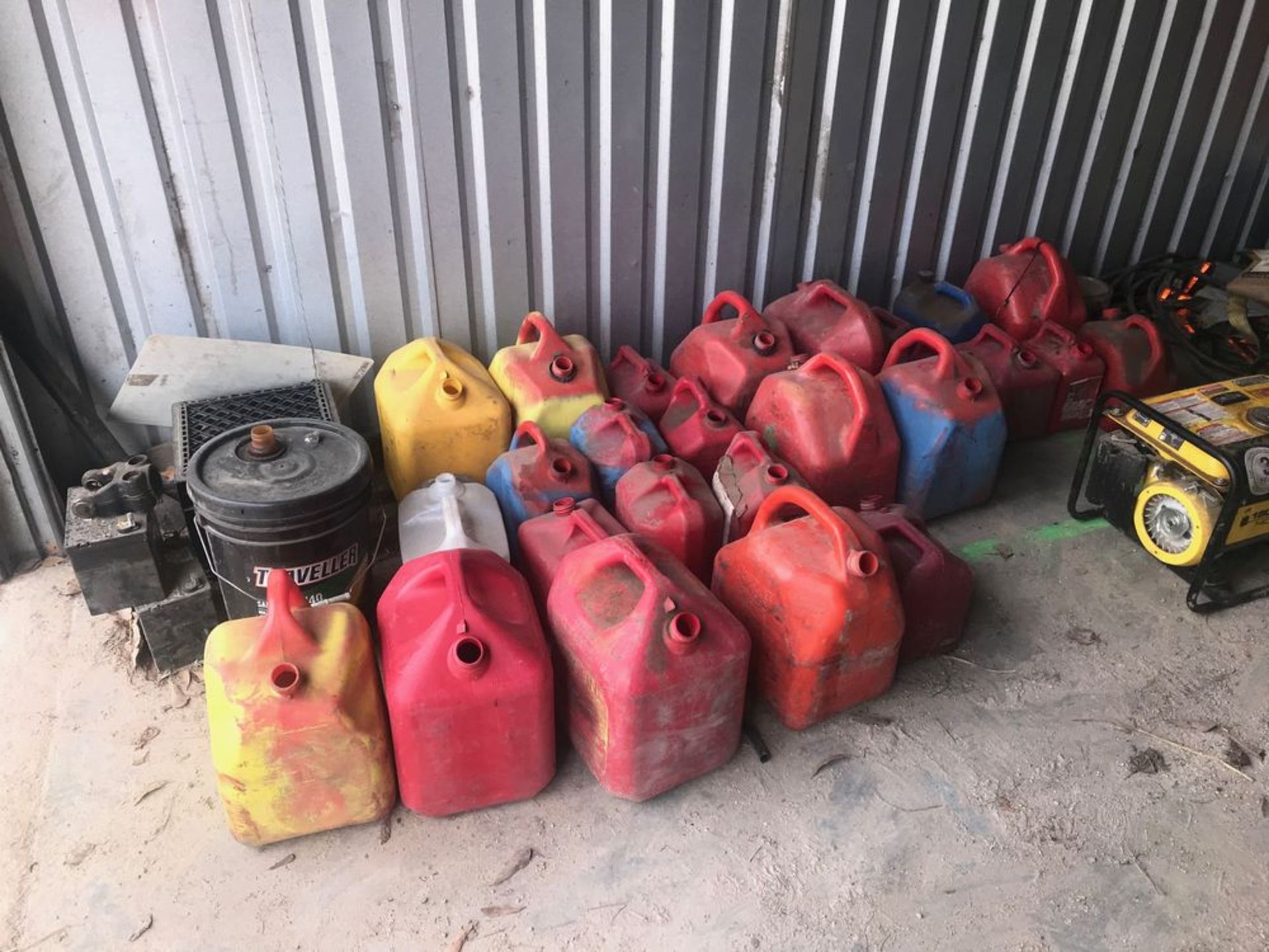 Contents of Last Two Building Bays including Gas Cans, Coolers, Roadside Flag Stands, Champion