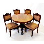 A Victorian mahogany loo table, the oval moulded top raised upon an octagonal tapering shaft, with