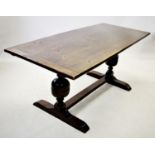 A 17th century style oak refectory table, with a cleated plank top raised upon a pair of bulbous