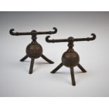 In the manner of Christopher Dresser, a pair of late 19th century brass andirons, possibly by Benham