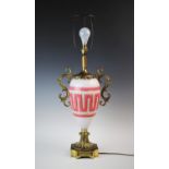 A large French glass and gilt brass mounted lamp base, 19th century, the central opaline glass