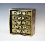 A late 19th/early 20th century laquered specimen chest, of small proportions, with five drawers, the