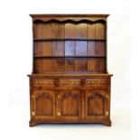 A George III style oak high back Welsh dresser, 20th century, with a moulded cornice above a