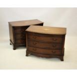 A pair of George III style bow front mahogany chests, the chest tops centred with an inlaid urn