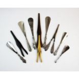 A selection of silver and white metal handled shoe horns, to include; one marked for E S