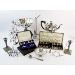 A collection of silver plate, to include, a pair of candlesticks, with twist form shafts, foliate