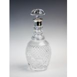 A silver mounted glass decanter, Israel Freeman & Son Ltd, London 1987, the molded glass body with