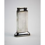 A 20th century silver plated Dunhill petrol table lighter, of typical plain polished form, 10cm high