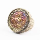 A sovereign set 9ct gold dress ring, the George V sovereign dated 1912, set to a raised textured