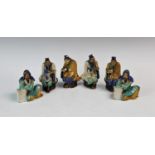 Three pairs of sancai glazed scholar figures, in typical blue, yellow and green shades, modelled