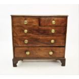 A George III mahogany chest of drawers, the rectangular moulded top above two short and three long