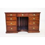 A Victorian mahogany twin pedestal desk, the rectangular leather inset top above a central frieze