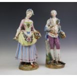 A pair of 19th century German porcelain classical figures, designed as a courting couple and