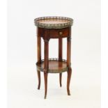 A Regency style mahogany sewing table, the glazed needlework top above a sliding linen box