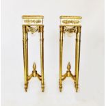 A pair of French style gilt wood torcheres, the square tops with gadroon borders above simulated