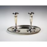 A pair of George V silver candlesticks, Sydney & Co, Birmingham 1913, of trumpet form, raised on