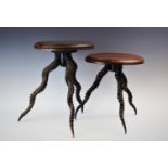 Two taxidermy antelope horn wine tables, each with circular stained oak top set on tripod antelope