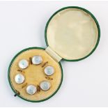 A set of six mother of pearl and turquoise buttons, each round button comprising a mother of pearl