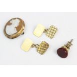 A pair of 9ct gold cufflinks, the rectangular form cufflinks with truncated corners and engraved