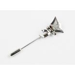 A Lady Taveners lapel pin by Graff, comprising ten brilliant cut diamonds pave set to stylised