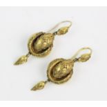 A pair of Victorian stylised snake form drop earrings, each comprising a stylised snake head mount