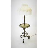 An Edwardian brass and onyx standard lamp table, the telescopic rope twist column supporting a