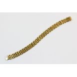 An 18ct gold brick link bracelet, the plain polished bracelet approx. 1.2cm wide, 19cm long,