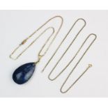 A sodalite pendant, teardrop-shaped polished sodalite measuring 52mm x 30mm, set to a yellow metal