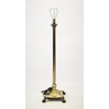 An early 20th century brass Corinthian column telescopic standard lamp, with a reeded column upon