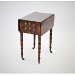 A George III mahogany work table, circa 1800, the rectangular drop leaf top with ebony inlay above a