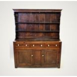 A late 18th/early 19th century oak Welsh dresser, the high back with a moulded cornice and plain