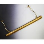 Four brass coated gallery lights, each with an arched canopy mounted upon a pair of adjustable