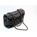 A Chanel Wild Stitch top clasp handbag, circa 2000 - 2002, the black calfskin leather bag with