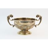 An Edwardian silver twin handled trophy, James Deakin & Sons, Sheffield 1907, of typical plain