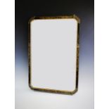 An early 20th century Japanned framed mirror, the black lacquered frame with gilt decoration,