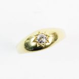 A diamond set gypsy style ring, comprising a central round old cut diamond approx. 3mm diameter,
