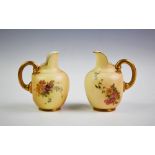 Two Royal Worcester blush ivory miniature flat back ewers, both shape number 1094, one with puce