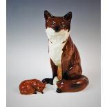 A Beswick model fireside fox, model no. 2348 31cm high, along with a Beswick model of a curled