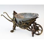 A late 19th century French table planter, designed as a wheelbarrow in the Rococo style, the gilt