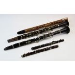 A collection of early 20th century and later wind instruments, to include, two clarinets, each